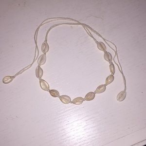 Braided puka shell string necklace